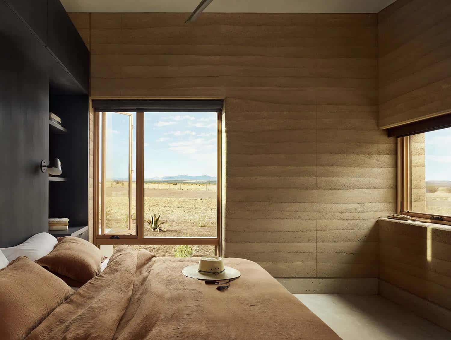 See this remarkable rammed earth house nestled on a Texas ranch-16