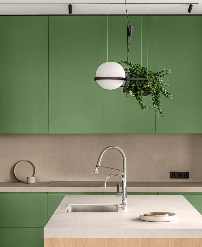 Green L-shaped Kitchen in Kyiv Apartment by Nadya Chabannaya - InteriorZine-0
