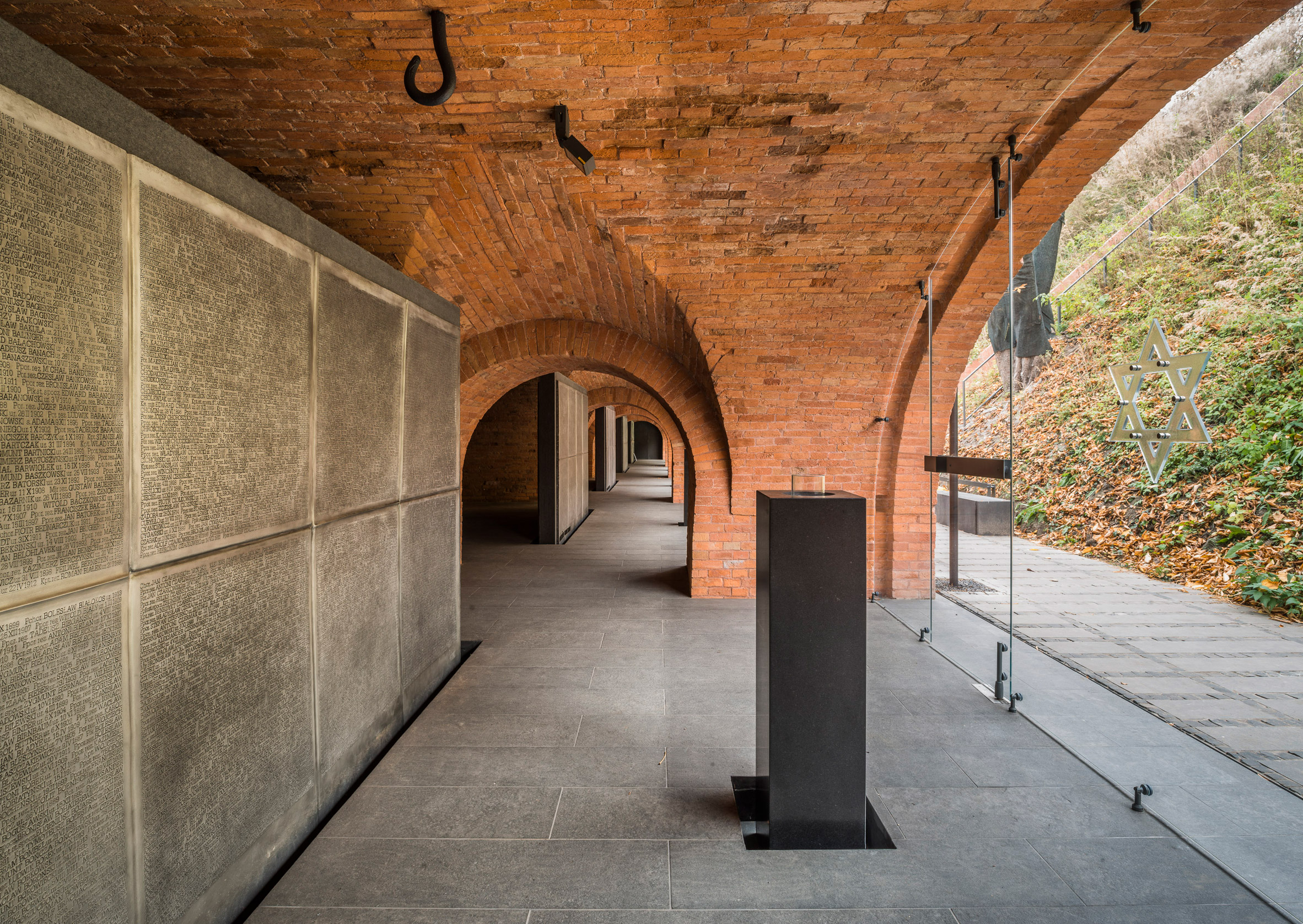 BBGK Architekci uses stained concrete walls to create Katyn Museum inside Warsaw barbican-4