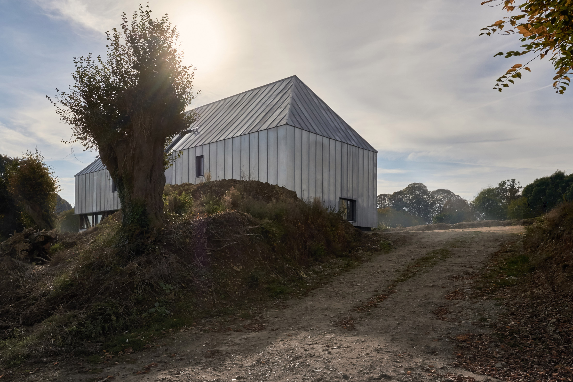 Antonin Ziegler covers abandoned barn in zinc plates to create rustic home in northern France-2