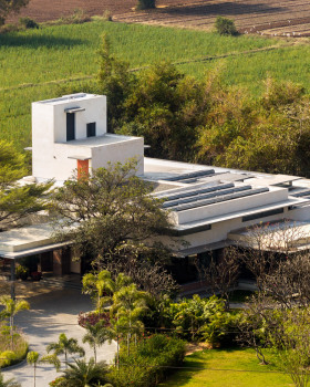 Rammed-earth walls enclose A House Born of Four Soils in India