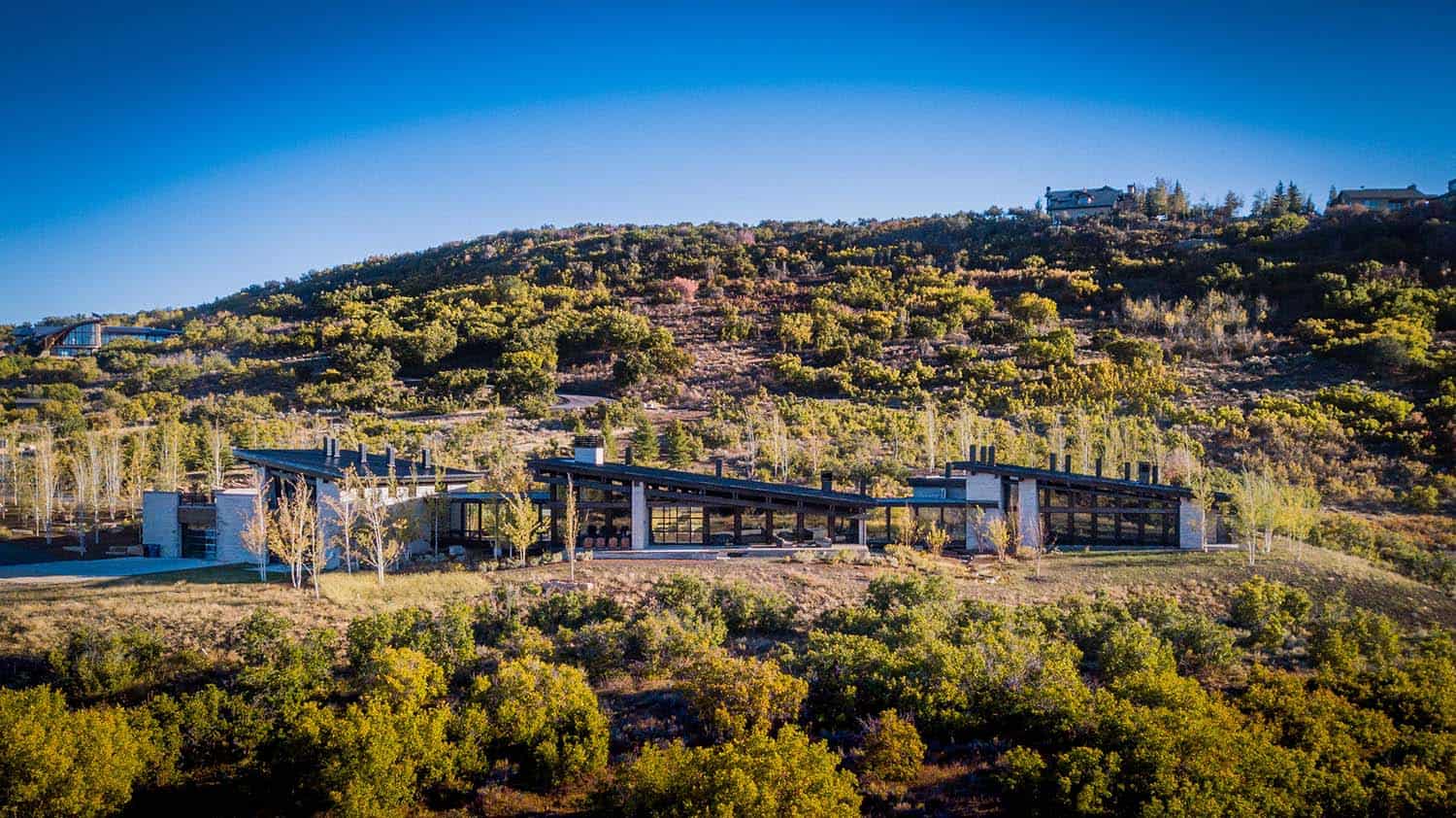 Majestic mountain home of stone and glass dominates its Utah landscape-29