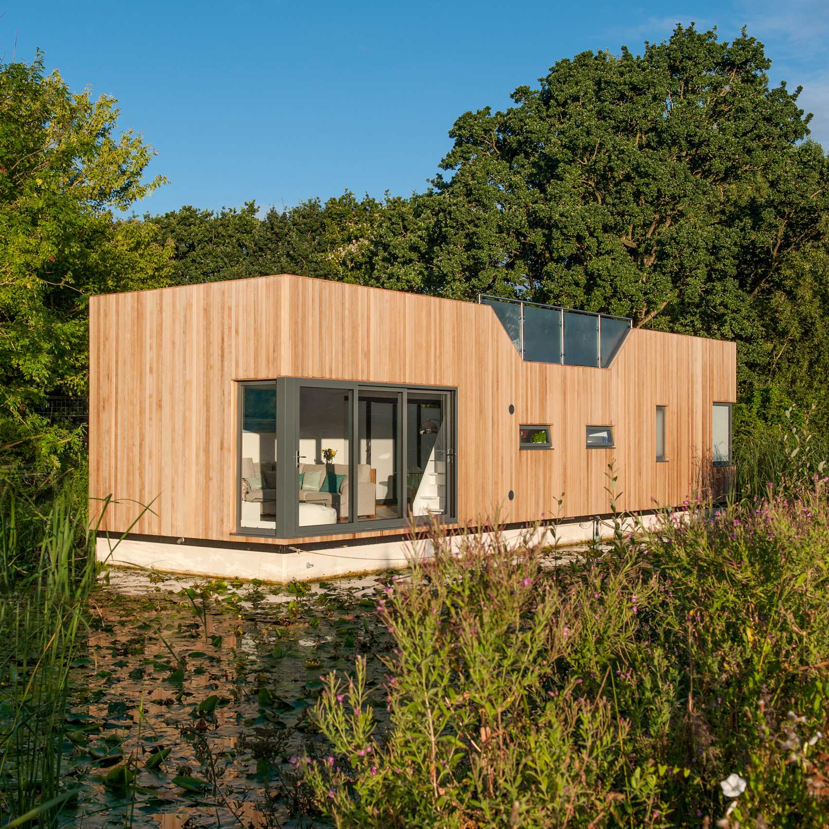 Baca Architects moors wooden floating home on Chichester Canal-0