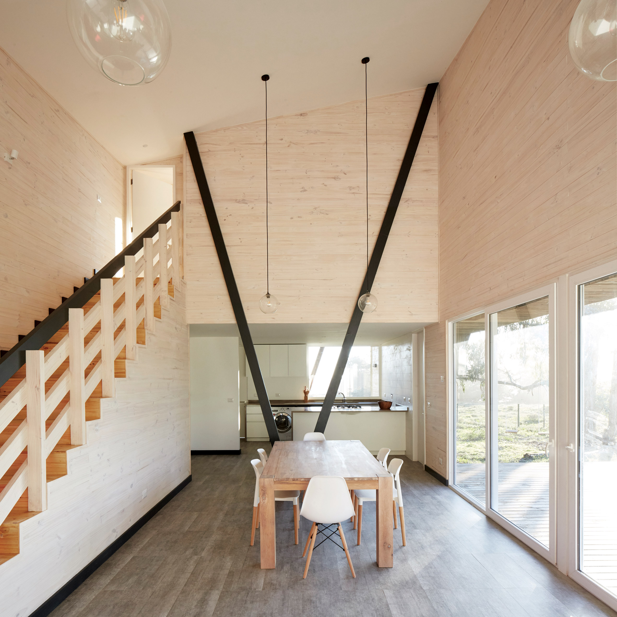 Faceted house in Chile by Verónica Arcos offers ocean views through the forest-9