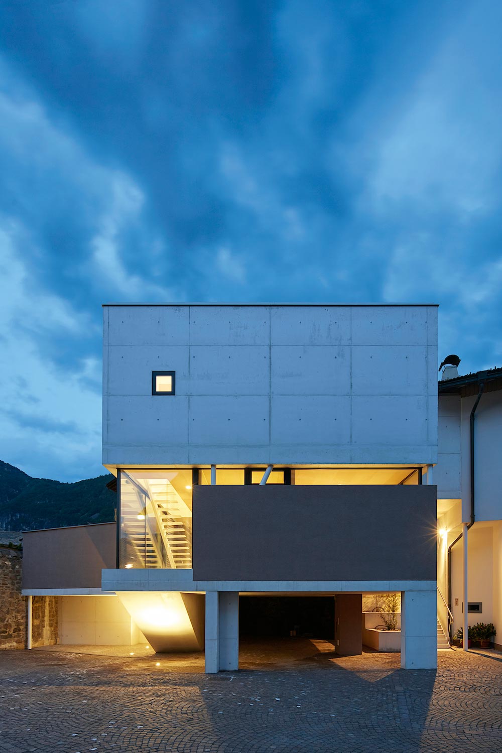 Concrete house uses old walls to create private patio allowing to add full glass walls to the residence   CAANdesign  Architecture and home design blog-17