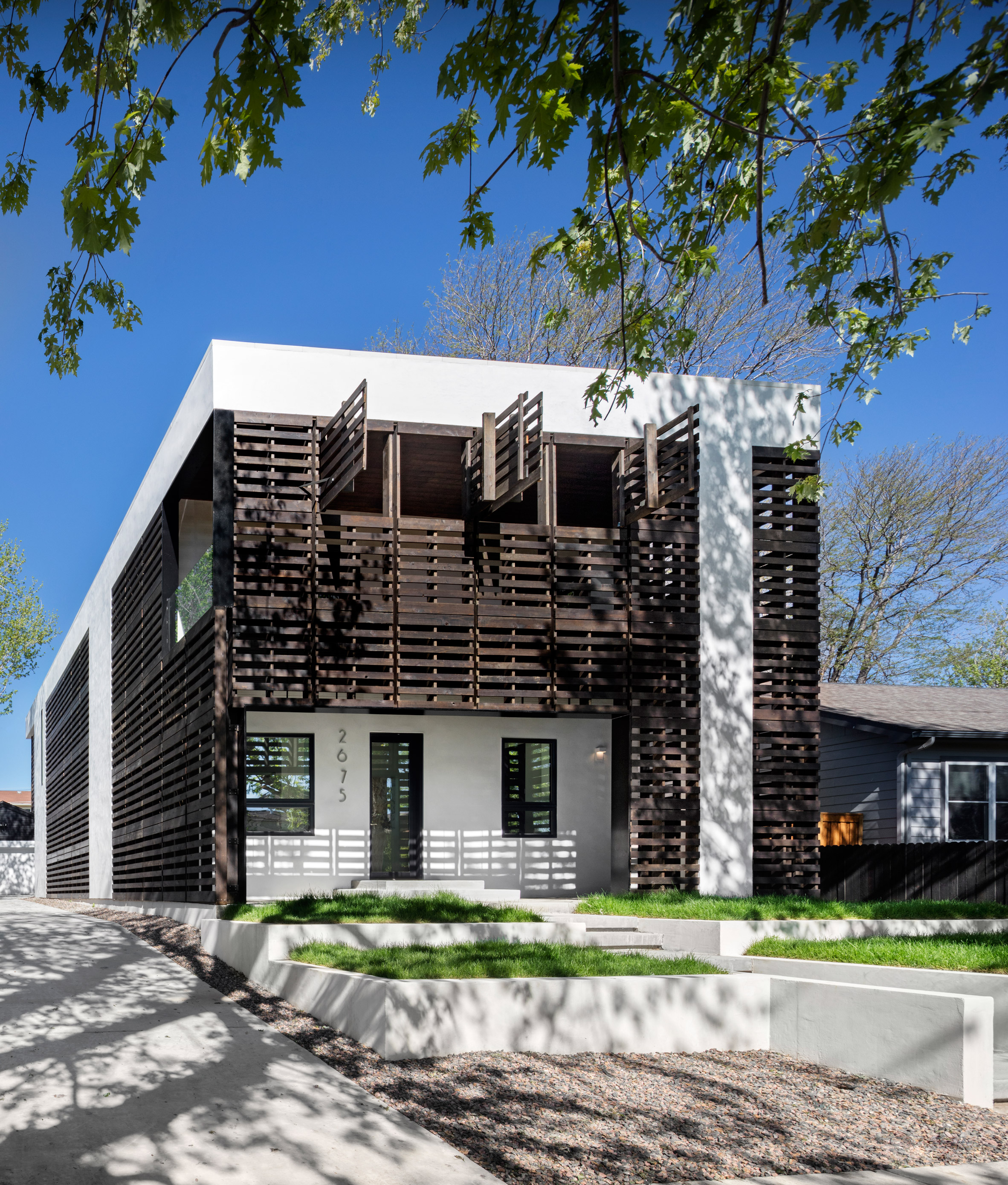 Meridian 105's Denver house features screens and shutters made of black wooden pallets-2