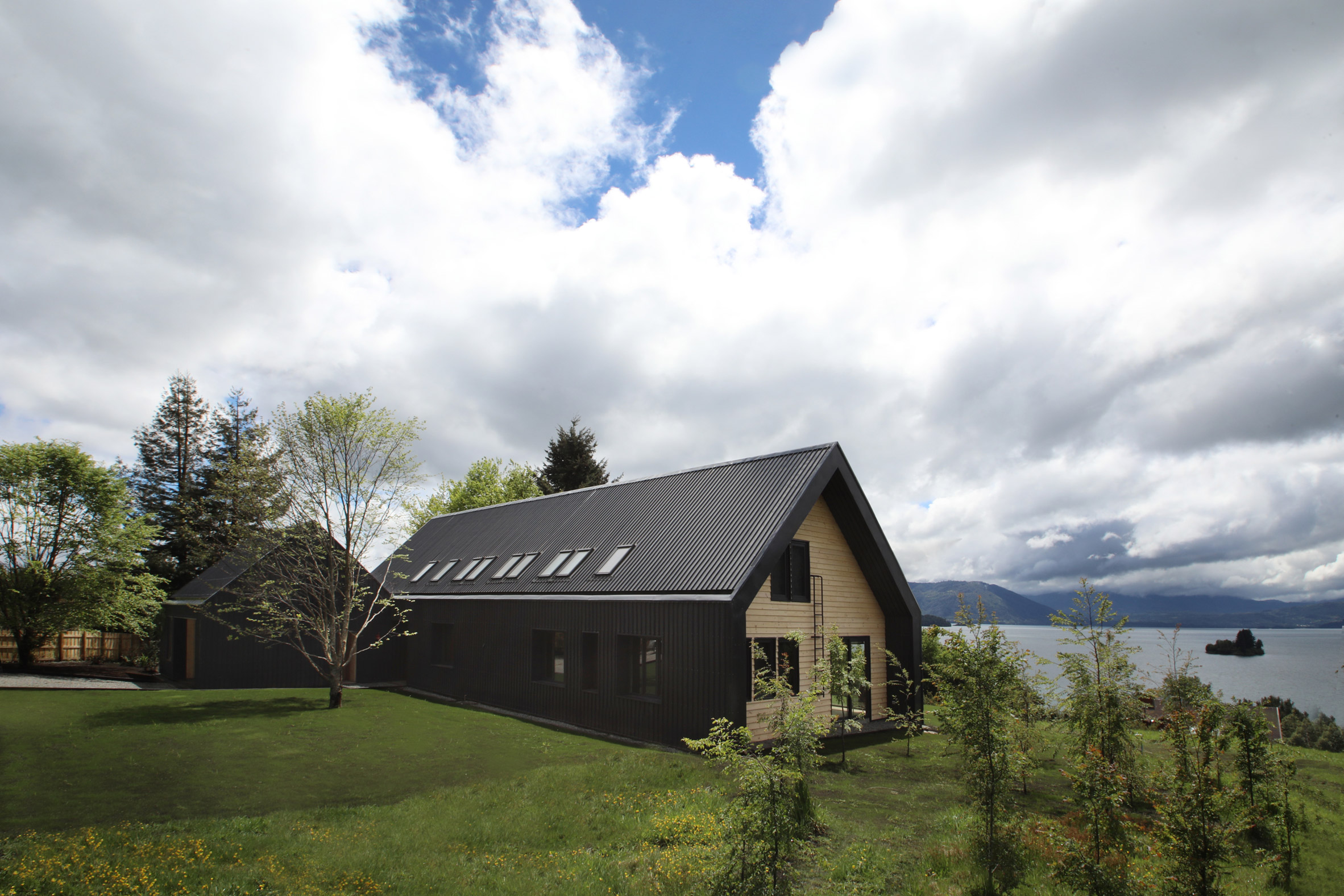 Apio Arquitectos creates gabled holiday house overlooking Chilean lake-2