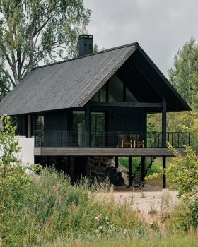 Stone cellar in Estonian forest forms base for wooden Põro House