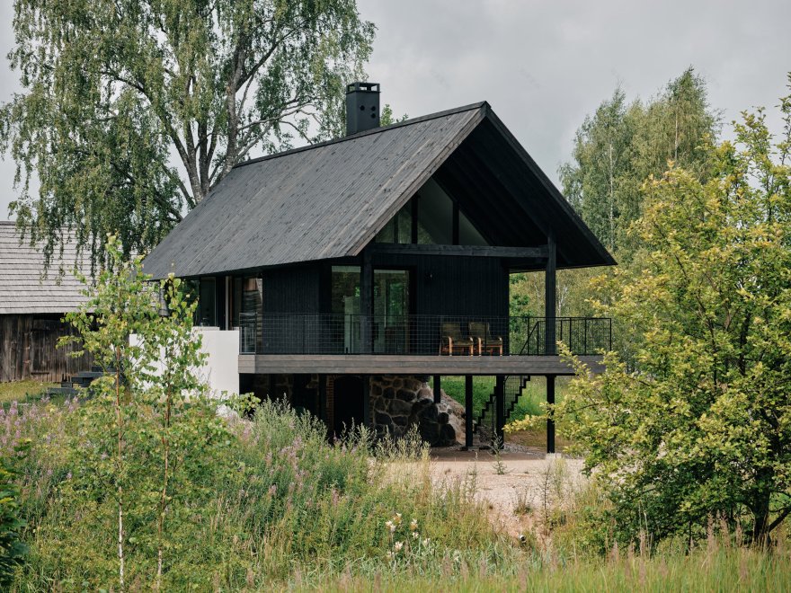 Stone cellar in Estonian forest forms base for wooden Põro House-4