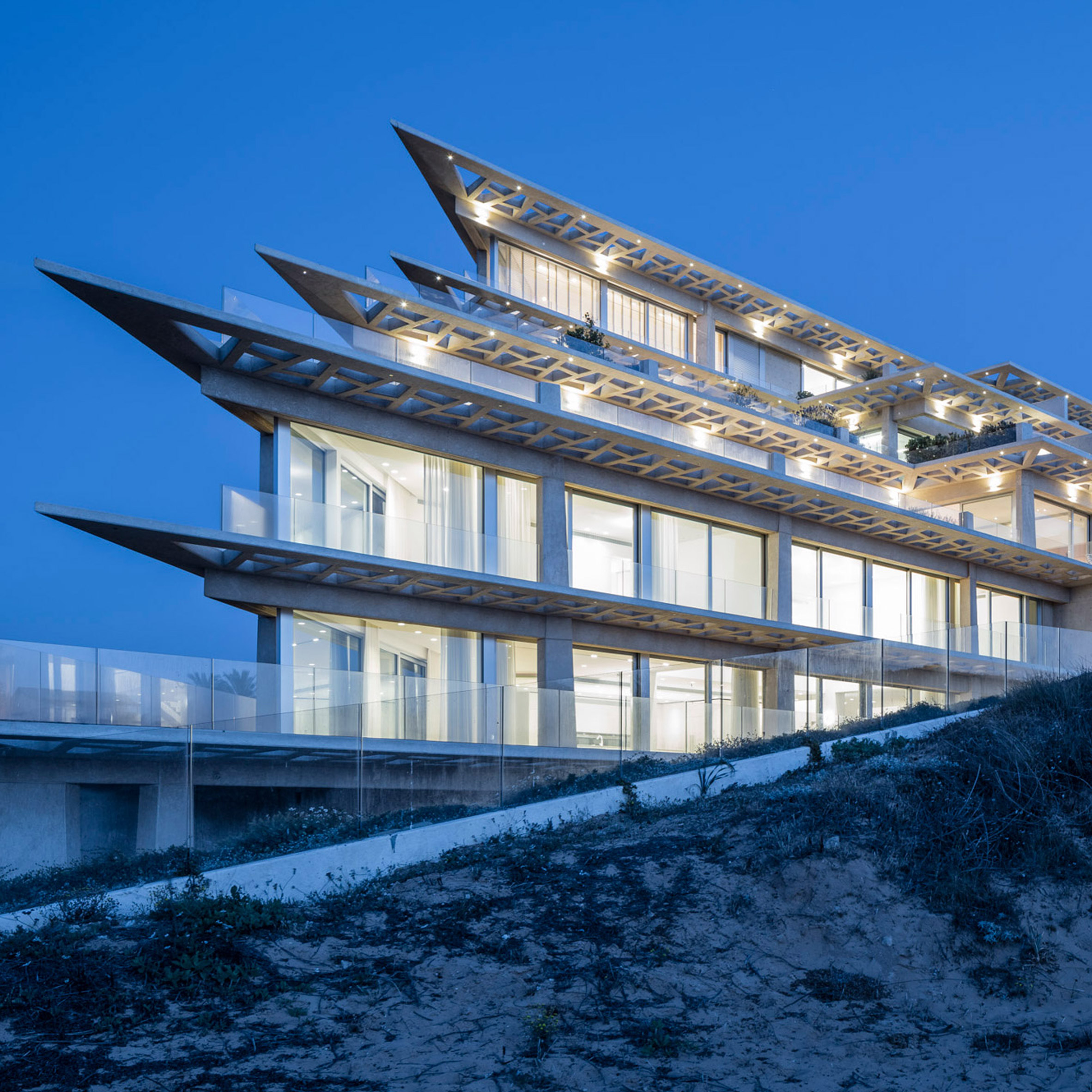 Perforated canopies shade terraces of cliff-top apartments near Tel Aviv-0