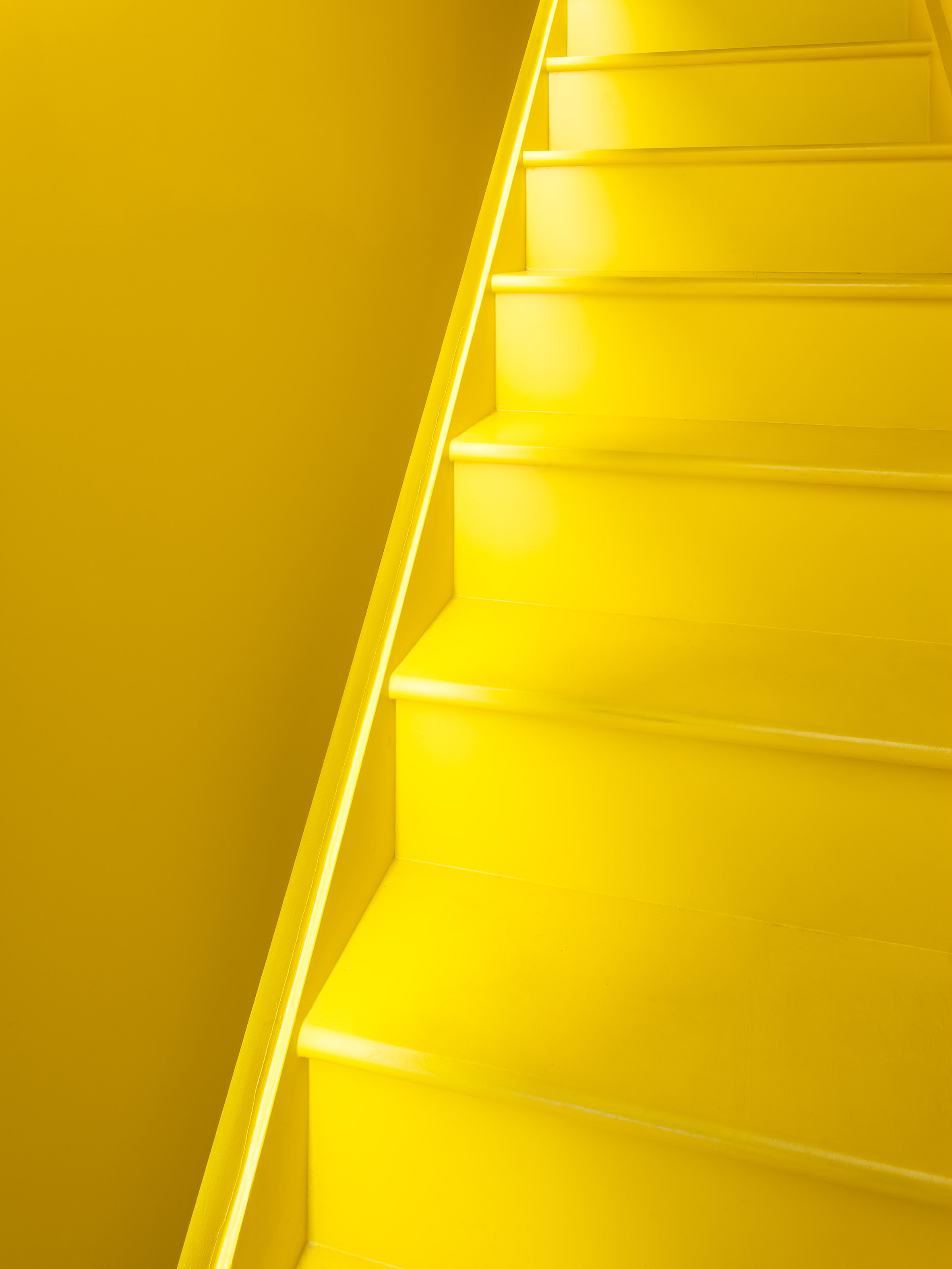 Yellow kitchen brightens basement of north London home-9