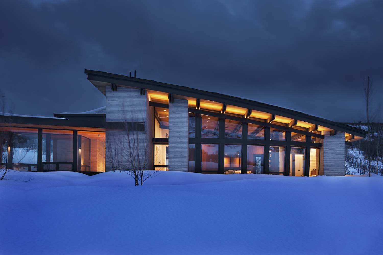 Majestic mountain home of stone and glass dominates its Utah landscape-0