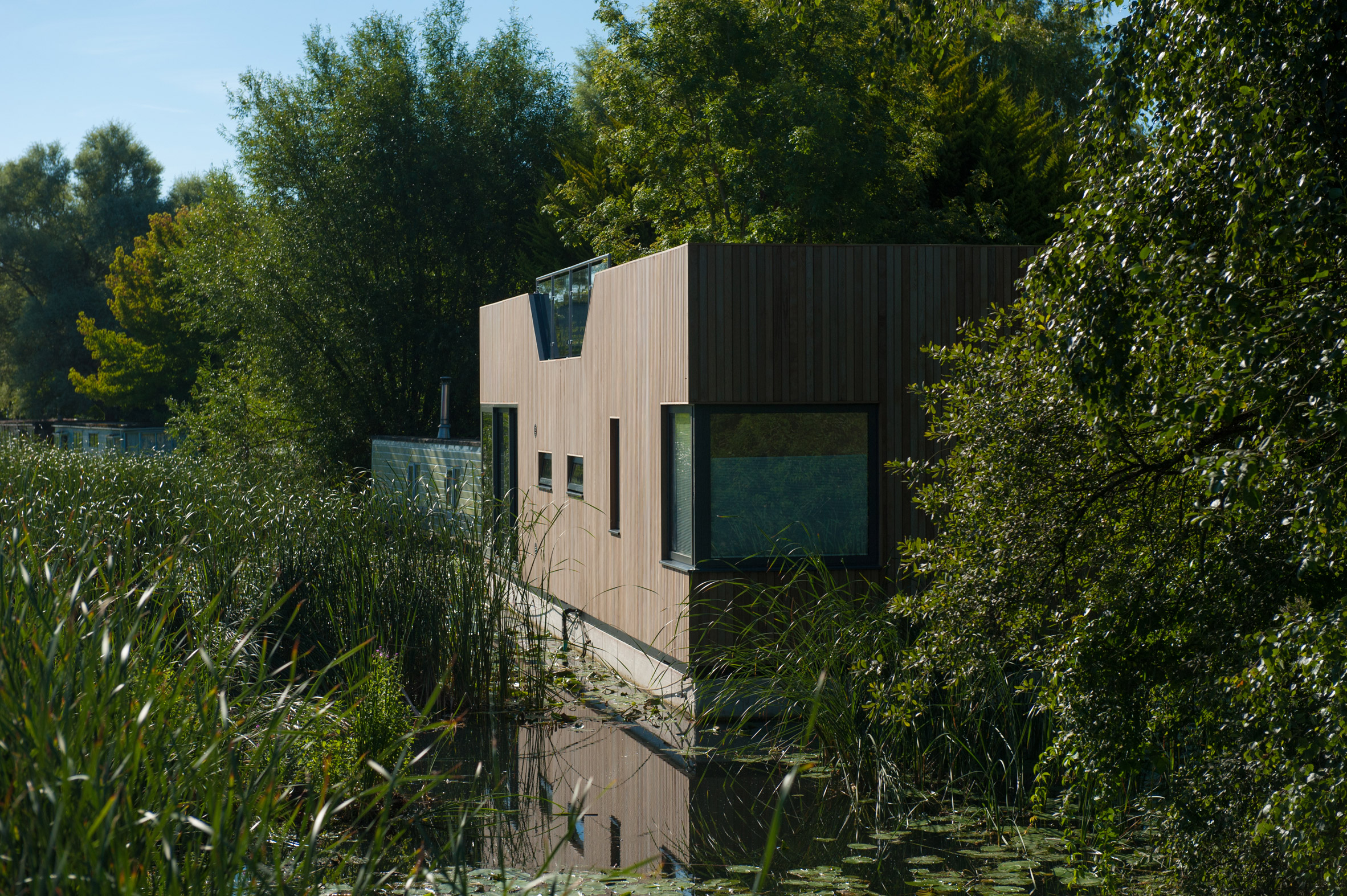 Baca Architects moors wooden floating home on Chichester Canal-7