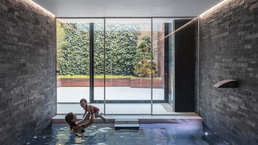 Glass box defines extension with basement pool to Victorian home in south London-0