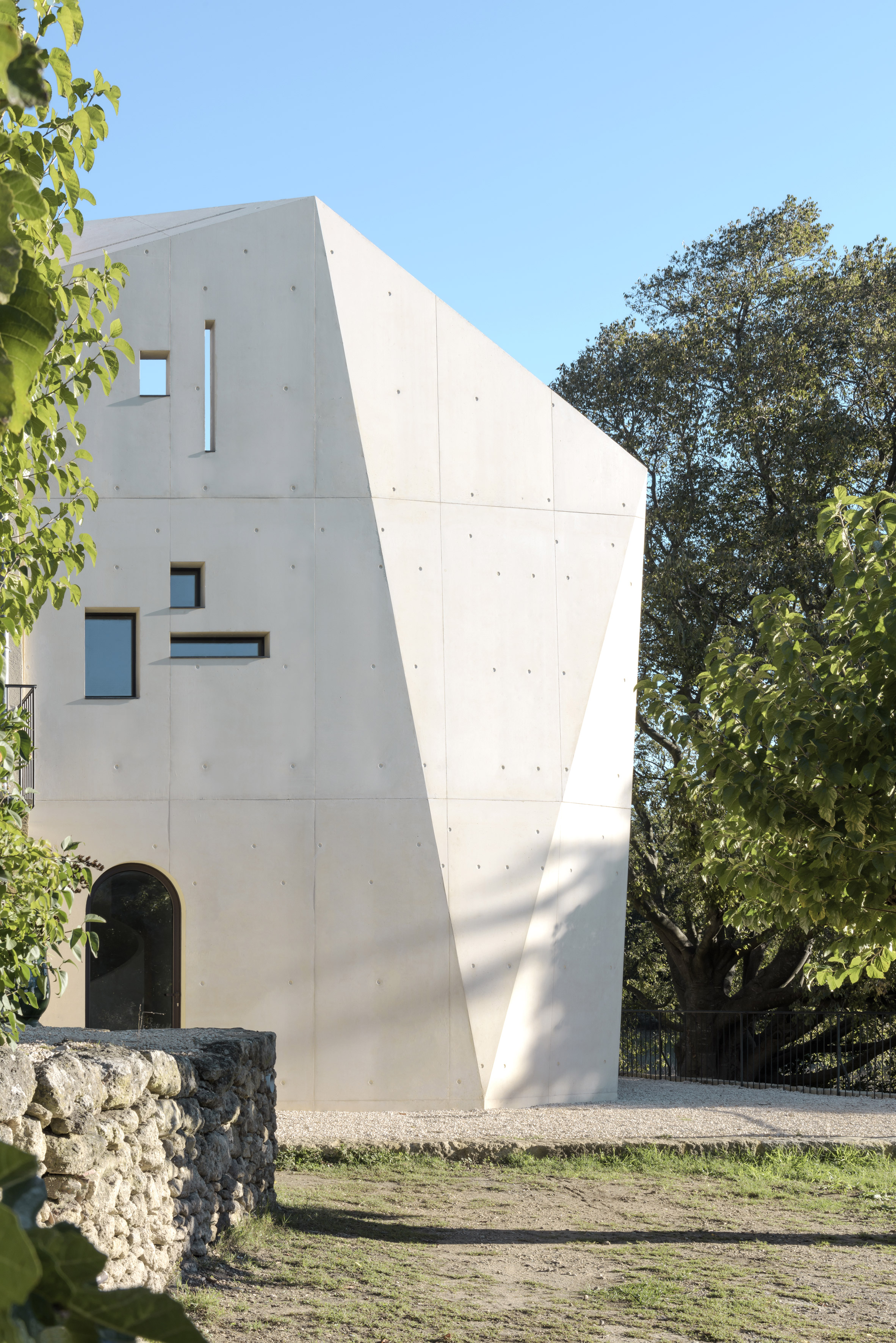 Sculptural extension to French farmhouse protects interiors from harsh summer sun-2