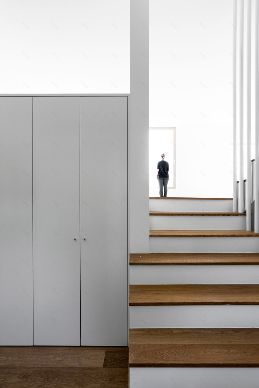 Swiss housing takes cues from mountainous landscape with zig-zag roof-20