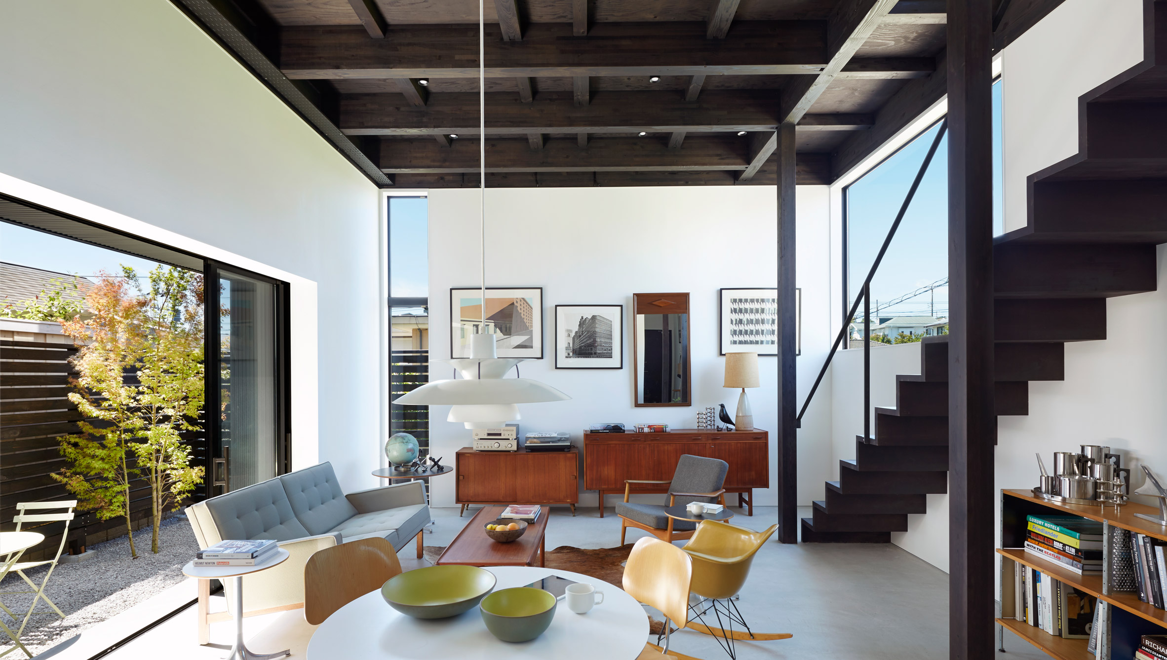 Black corrugated metal encases loft-inspired interiors of Japanese house by TakaTina-9