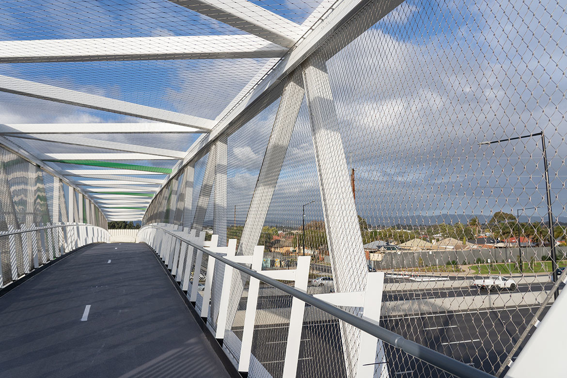 Held together by function and aesthetics: tensile mesh barriers and facades | IndesignLive-3