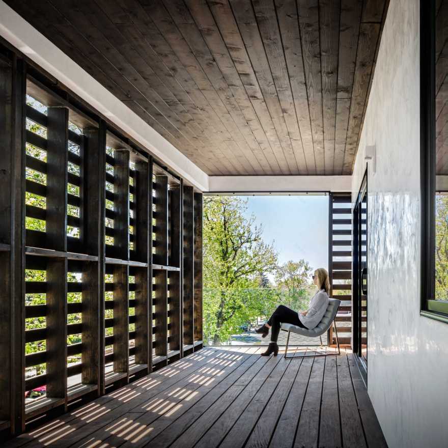 Meridian 105's Denver house features screens and shutters made of black wooden pallets-0