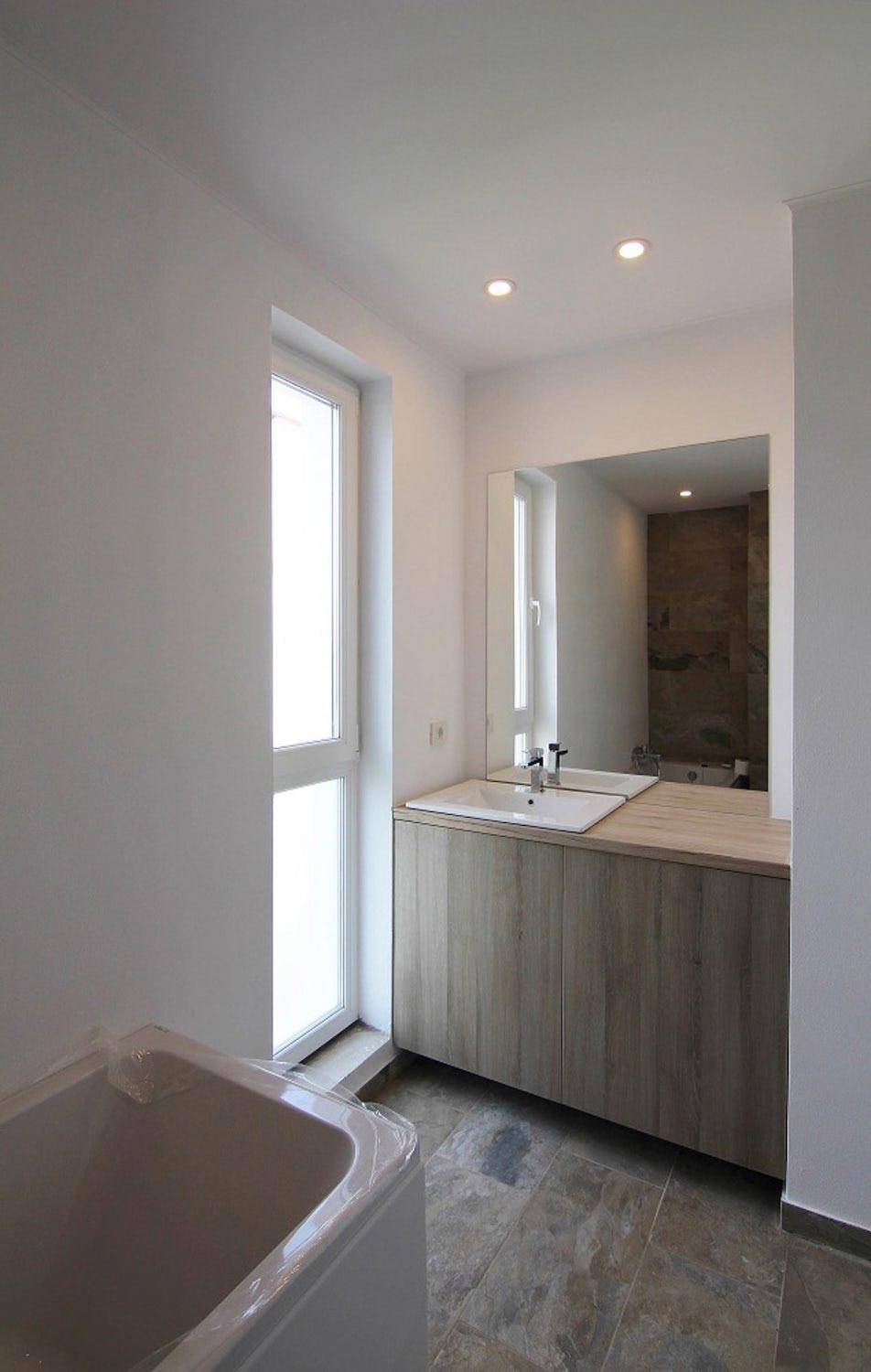 Project built on a very small piece of land with minimal modern features and design defined by white, black and timber hues   CAANdesign  Architecture and home design blog-9