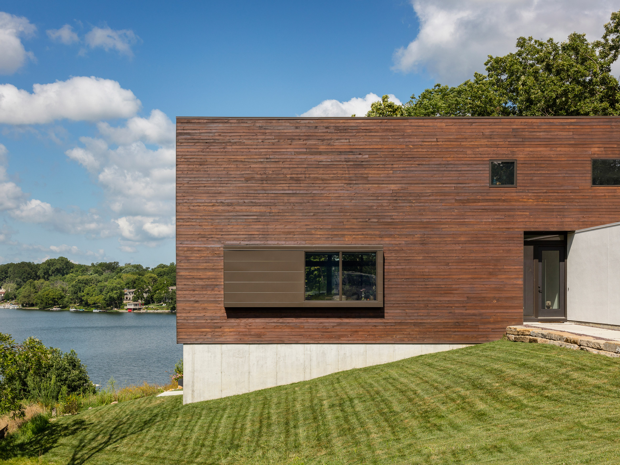 Kem Studio wraps lakeside Missouri residence in cypress and white stucco-8