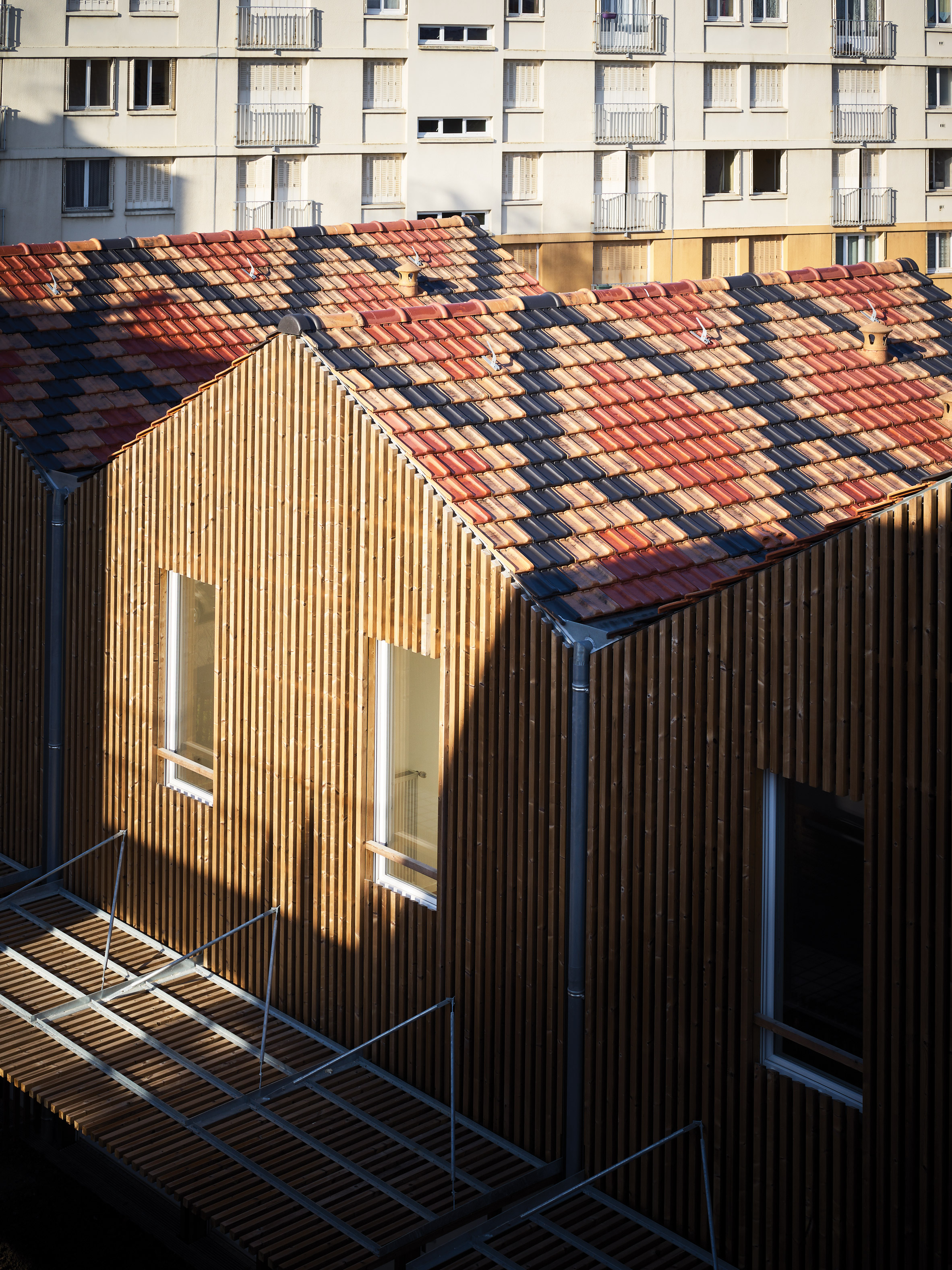 Odile Guzy Architectes covers social housing with vertical wooden slats-2