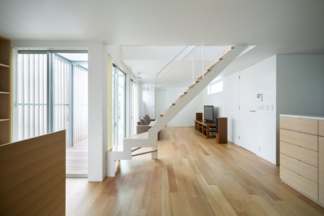 House K by Yuji Kimura Design conceals terraces behind a tall wall-16