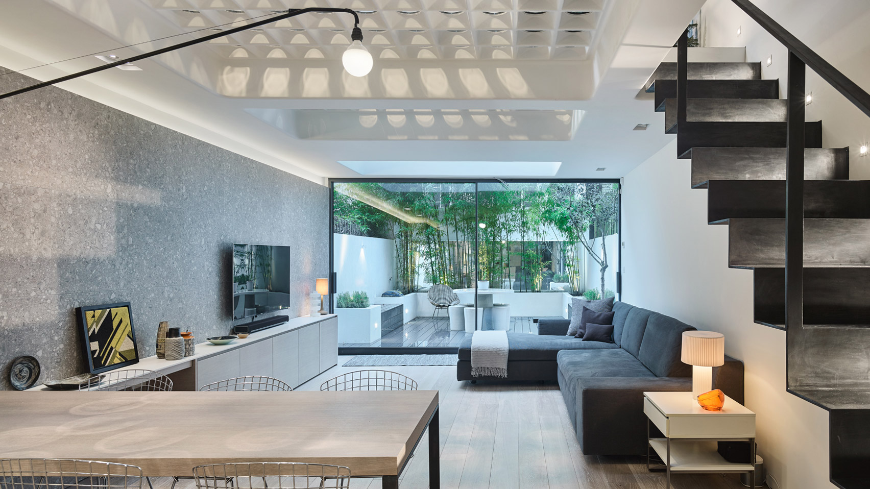 Perforated steel and pavement lights let the sun pierce Andy Martin Architecture's London townhouse-0
