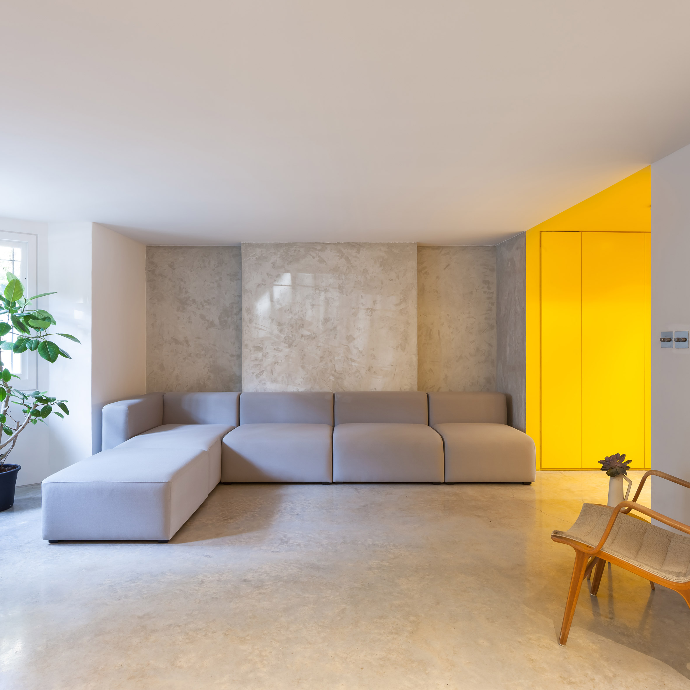 Yellow kitchen brightens basement of north London home-13
