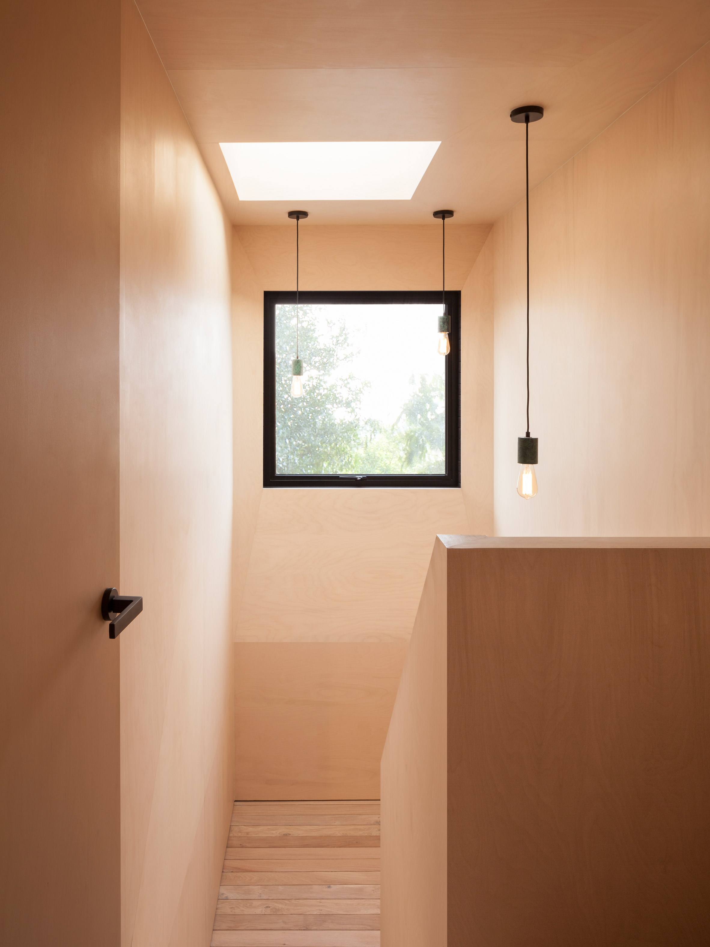 Plywood-lined bedrooms feature in loft conversion by Widger Architecture-3