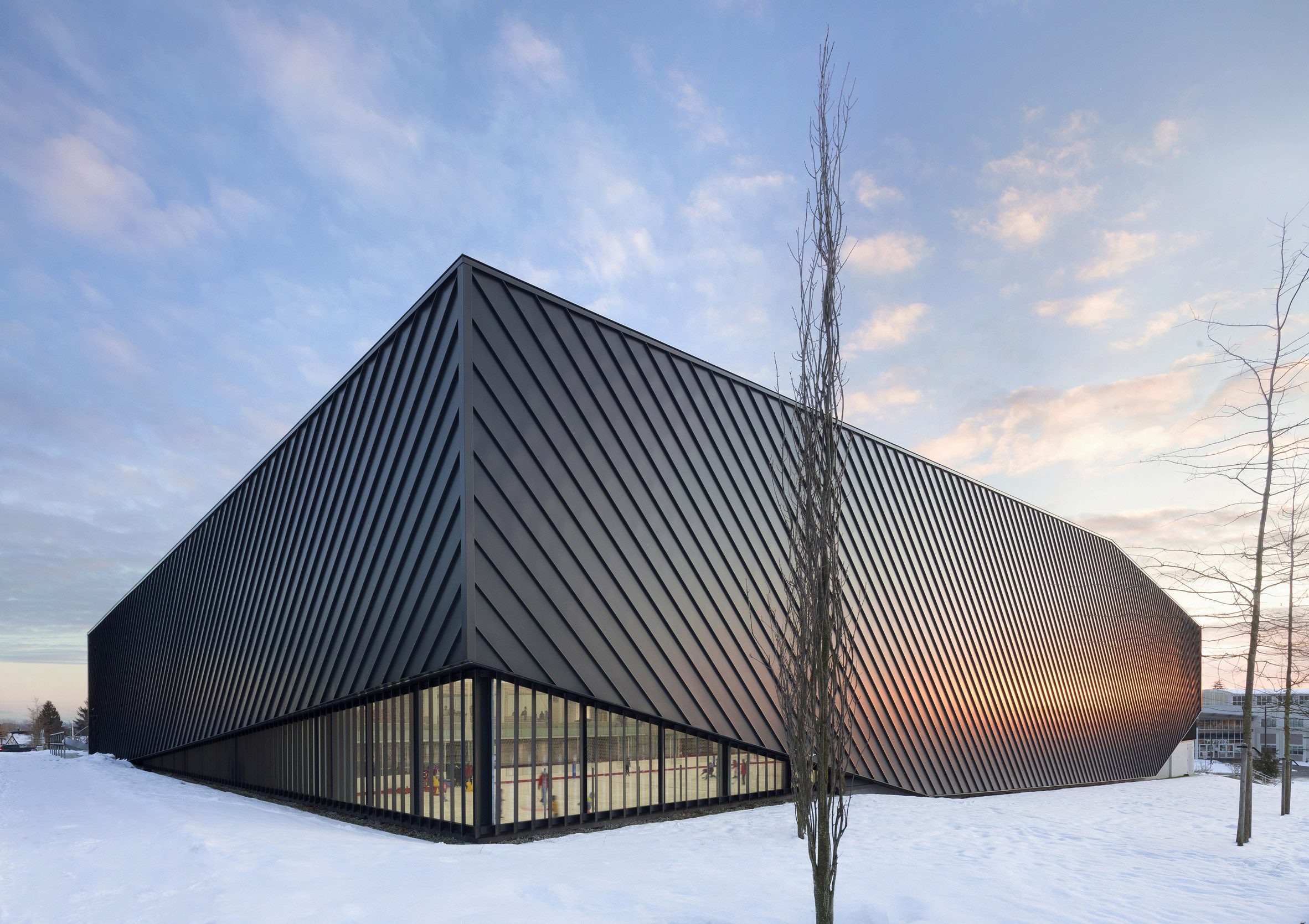 Mass timber adds visual warmth to British Columbia ice arena by HCMA-3