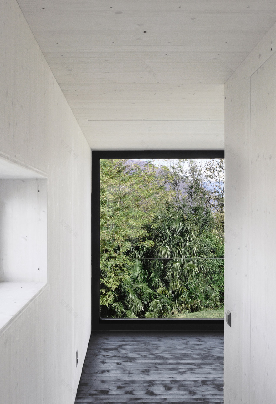 This prefabricated wooden holiday home is clad in charred timber boards-21