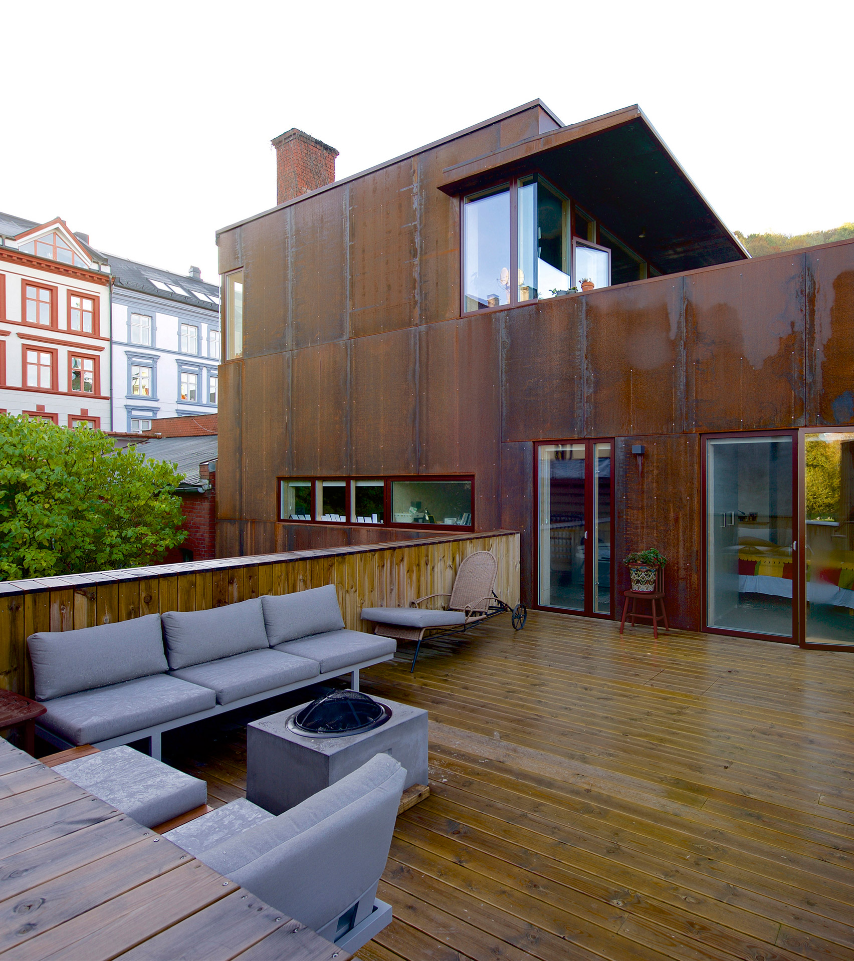 Weathering steel panels create rusty walls for house in Oslo's old town-21