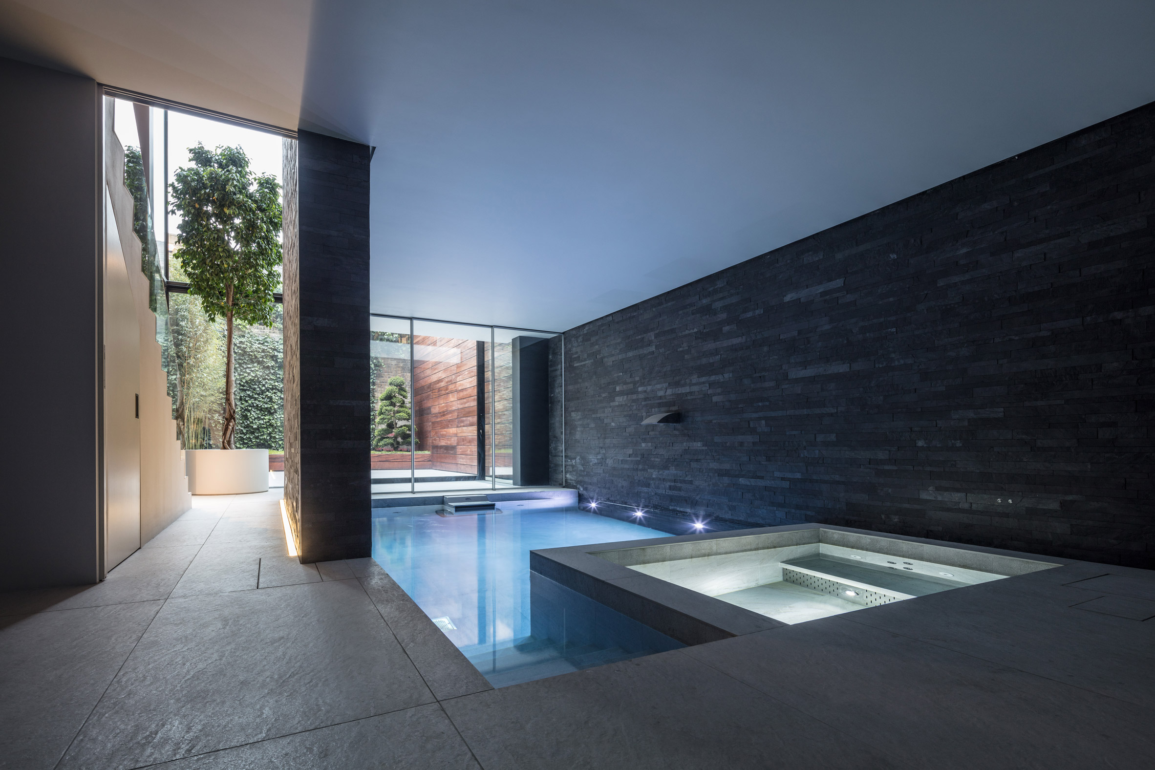 Glass box defines extension with basement pool to Victorian home in south London-8