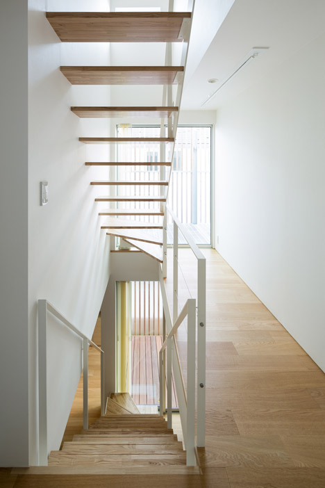 House K by Yuji Kimura Design conceals terraces behind a tall wall-26