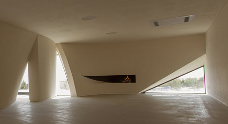 Next Office covers house near Tehran in a curved concrete facade-16