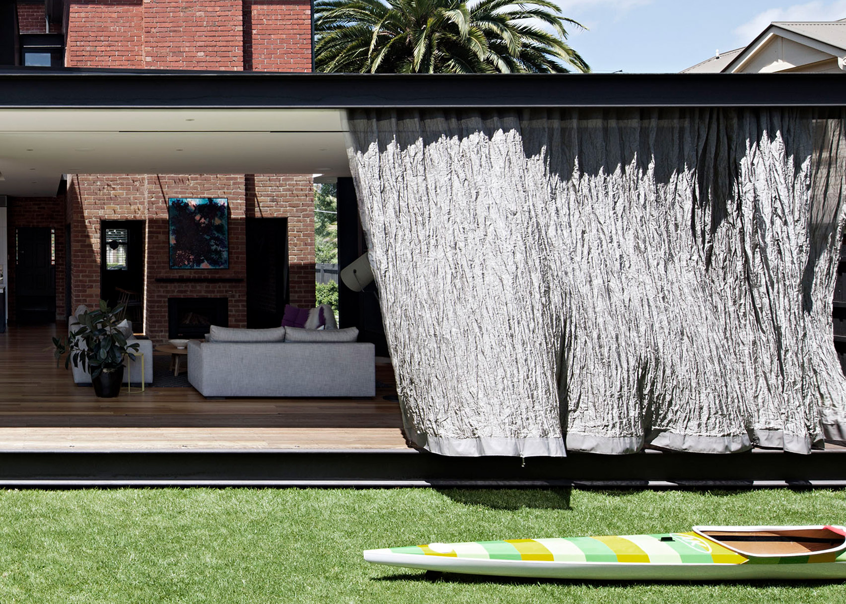 "Free flowing and kinetic" metal-mesh curtain wraps around extension to Melbourne house-0