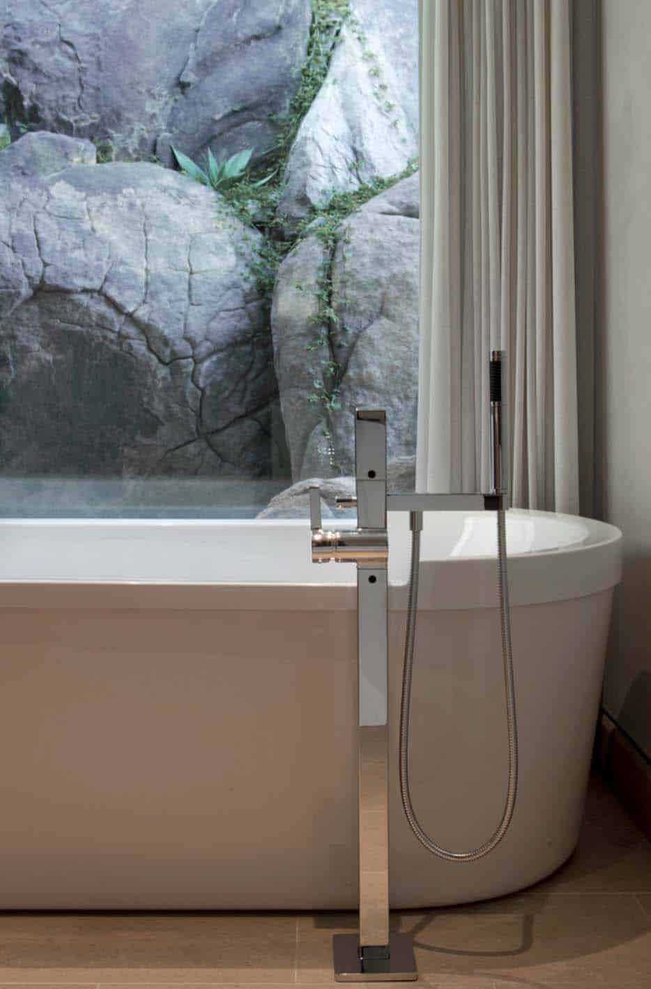 Modern desert home set on a rocky hillside with spectacular city views-25