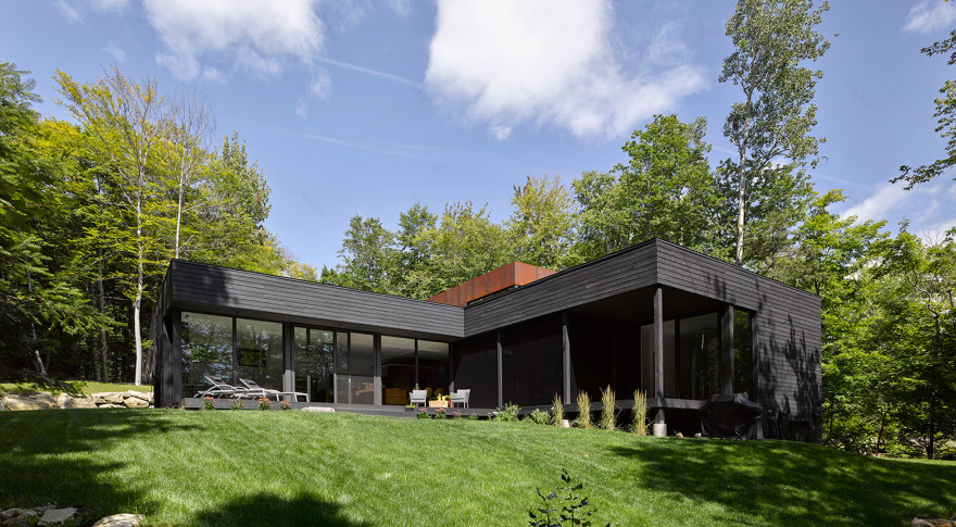 Canadian lake house by Paul Bernier features dark rusted metal cladding-18
