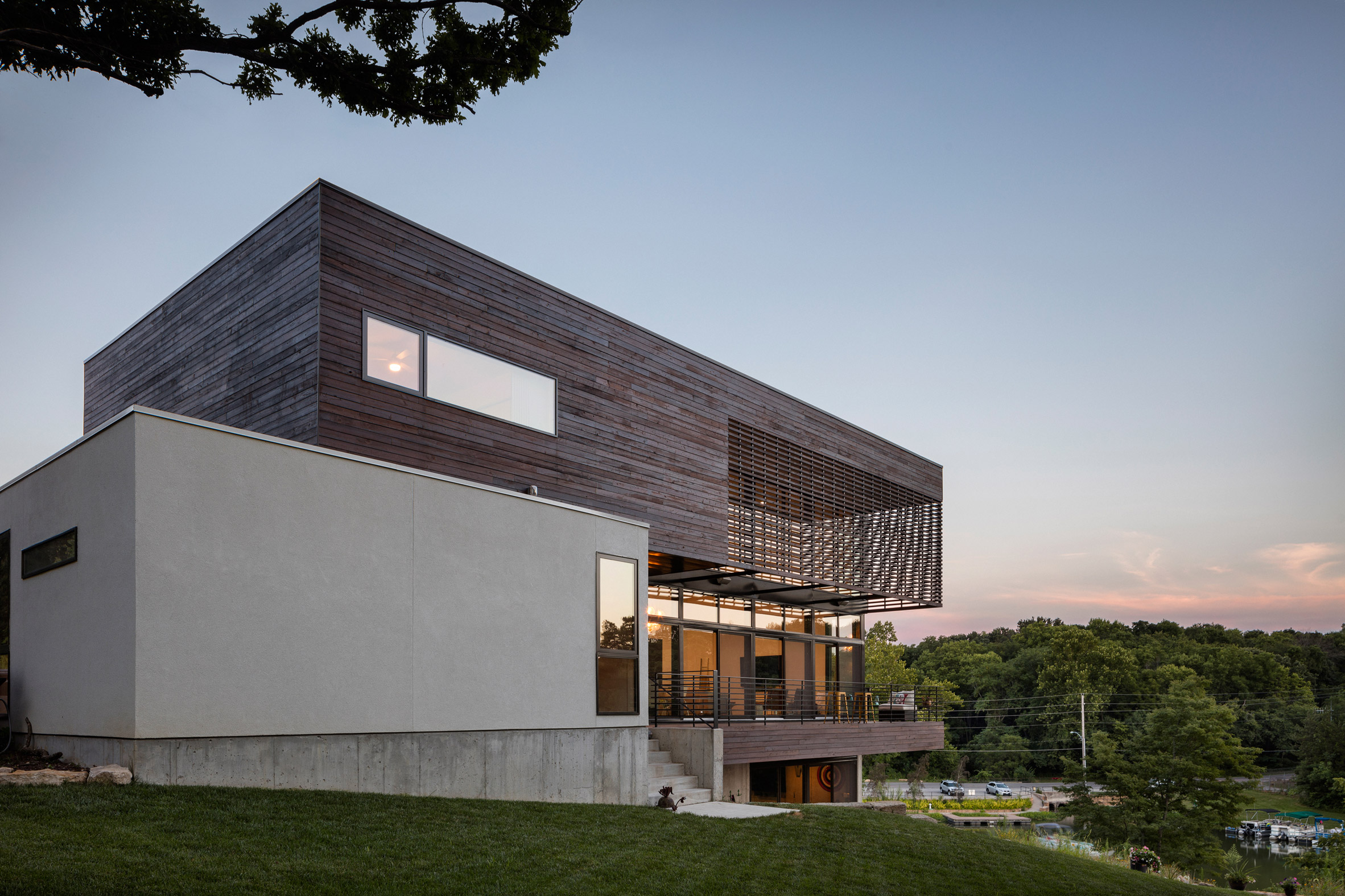 Kem Studio wraps lakeside Missouri residence in cypress and white stucco-11