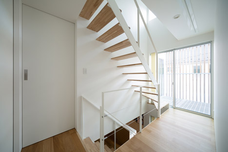 House K by Yuji Kimura Design conceals terraces behind a tall wall-28