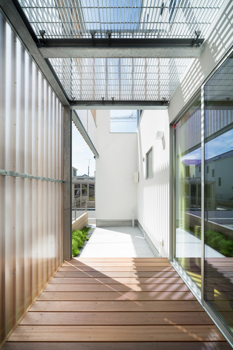 House K by Yuji Kimura Design conceals terraces behind a tall wall-10