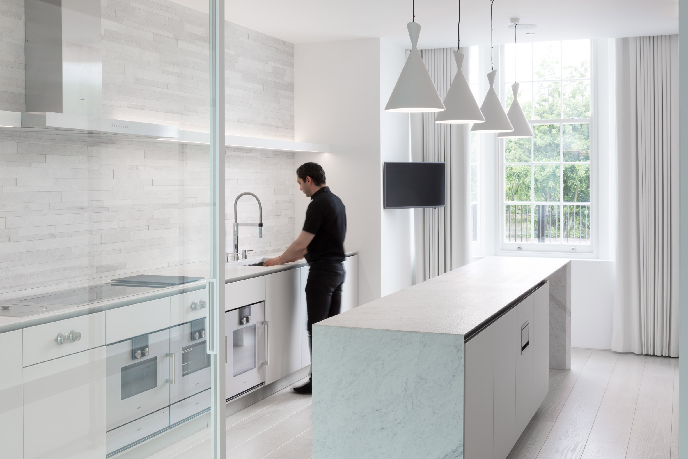 Glass box defines extension with basement pool to Victorian home in south London-11