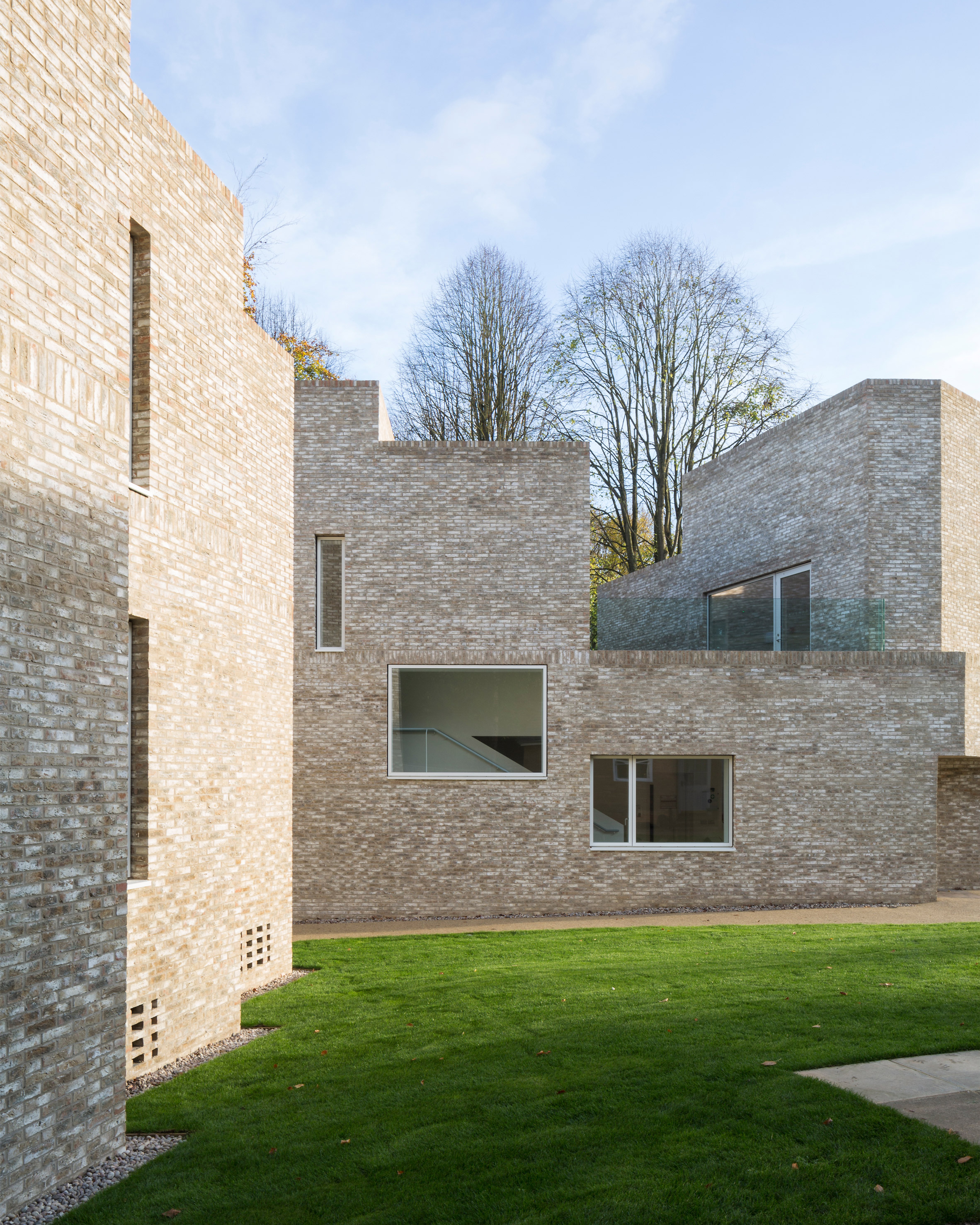 Geometric brick-clad boarding house by MICA references its neighbours-8