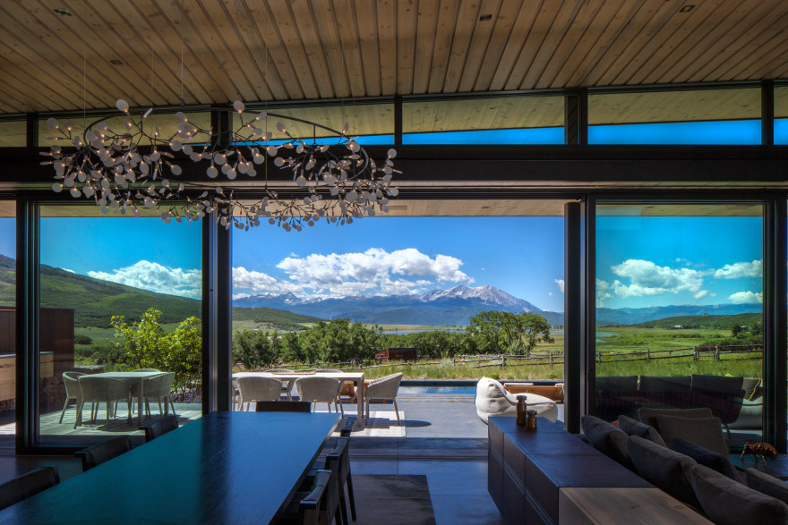 CCY Architects uses weathering steel and locally quarried stones for Colorado home-12