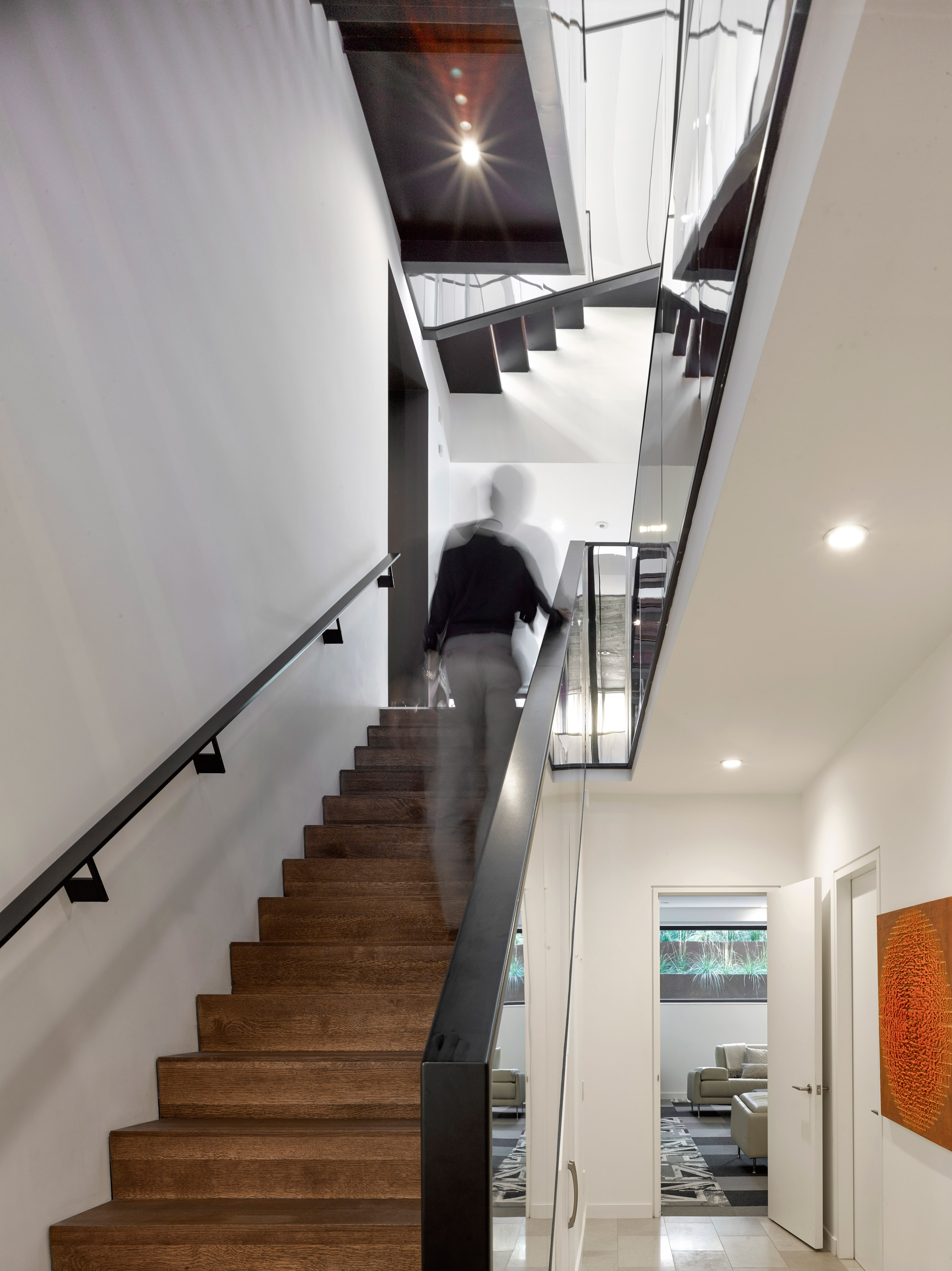 Mirrored staircase features in Kaleidoscope House by Paul Raff Studio-12