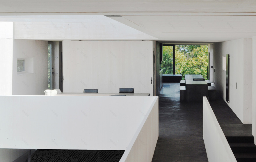 This prefabricated wooden holiday home is clad in charred timber boards-18