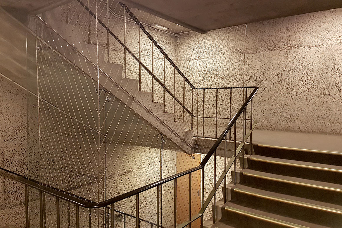 Held together by function and aesthetics: tensile mesh barriers and facades | IndesignLive-6