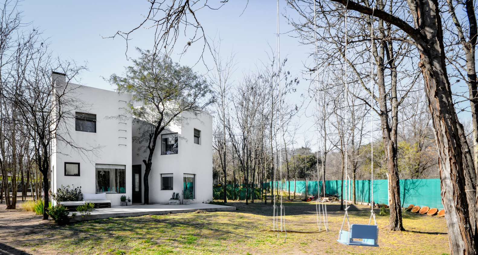 阿根廷相思树森林中的简约住宅群-32