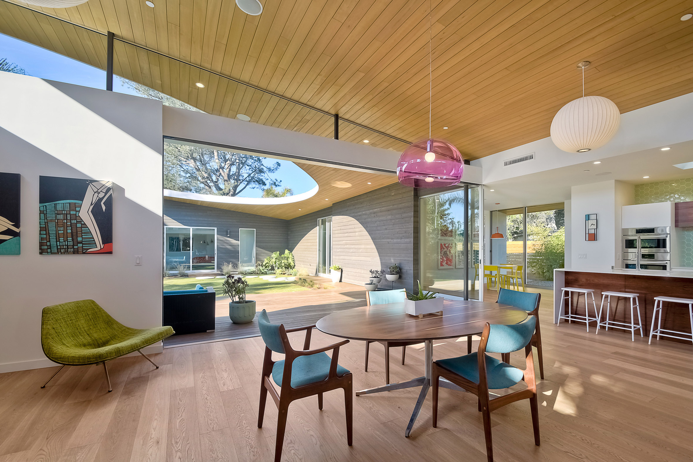 Southern California beach home features angled roof with crescent cutout-8